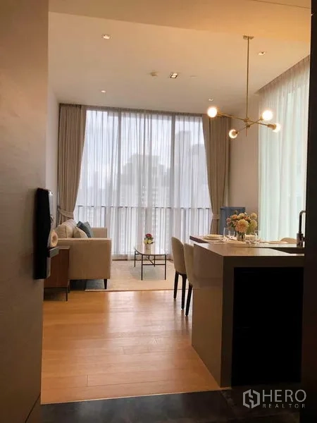 Condominium for rent - Another entry view of the living room and kitchen island with city-facing windows.