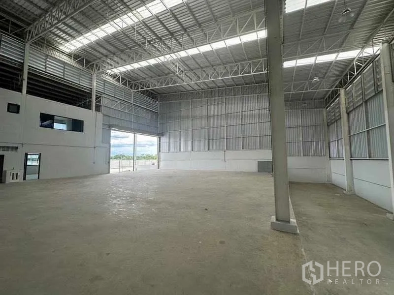 Factory for rent in Wang Noi, Phra Nakhon Si Ayutthaya - Second-floor office space with long window wall, glossy tiles, and stair access.