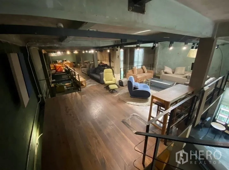 Retail Space for rent in Bang Na, Bangkok - Upper level with wooden flooring and modern lounge seating