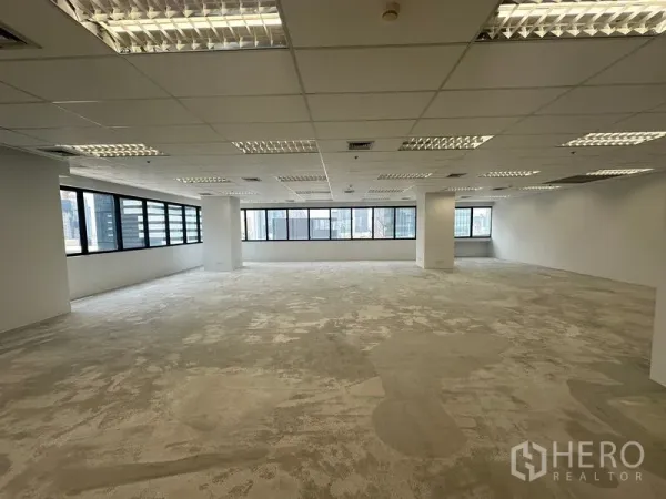 Office Space for rent in Bang Rak, Bangkok - Corner office area with long bands of windows providing abundant natural light.