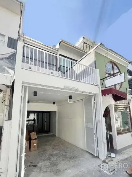 Home Office for rent in Khlong Toei, Bangkok - Renovated townhouse-style home office exterior with gated garage and upper balcony.