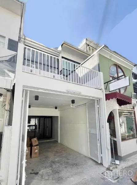 Home Office for rent in Khlong Toei, Bangkok - Renovated townhouse-style home office exterior with gated garage and upper balcony.