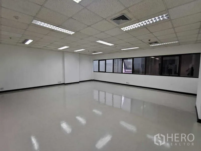 Office Space for rent in Watthana, Bangkok - Corner office space with wide strip windows and natural light.