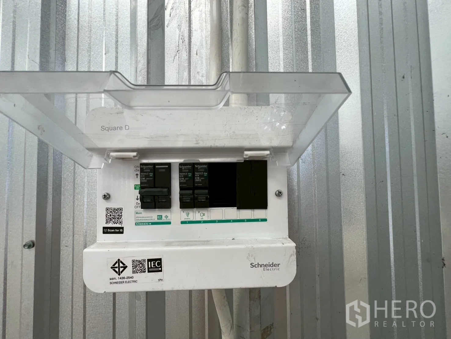 Warehouse for rent in Min Buri, Bangkok - Schneider Electric breaker panel installed on a metal wall inside the warehouse.