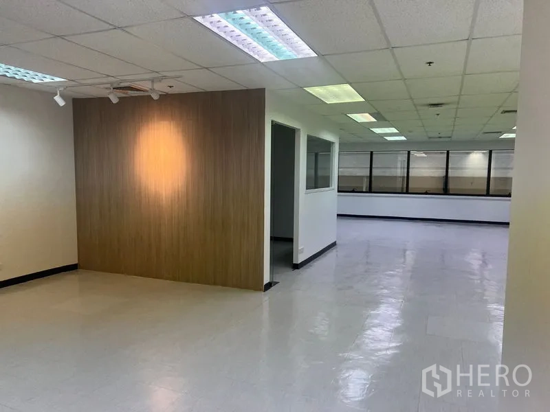 Office Space for rent in Watthana, Bangkok - Spacious office corridor with a wood accent wall and long, open layout.