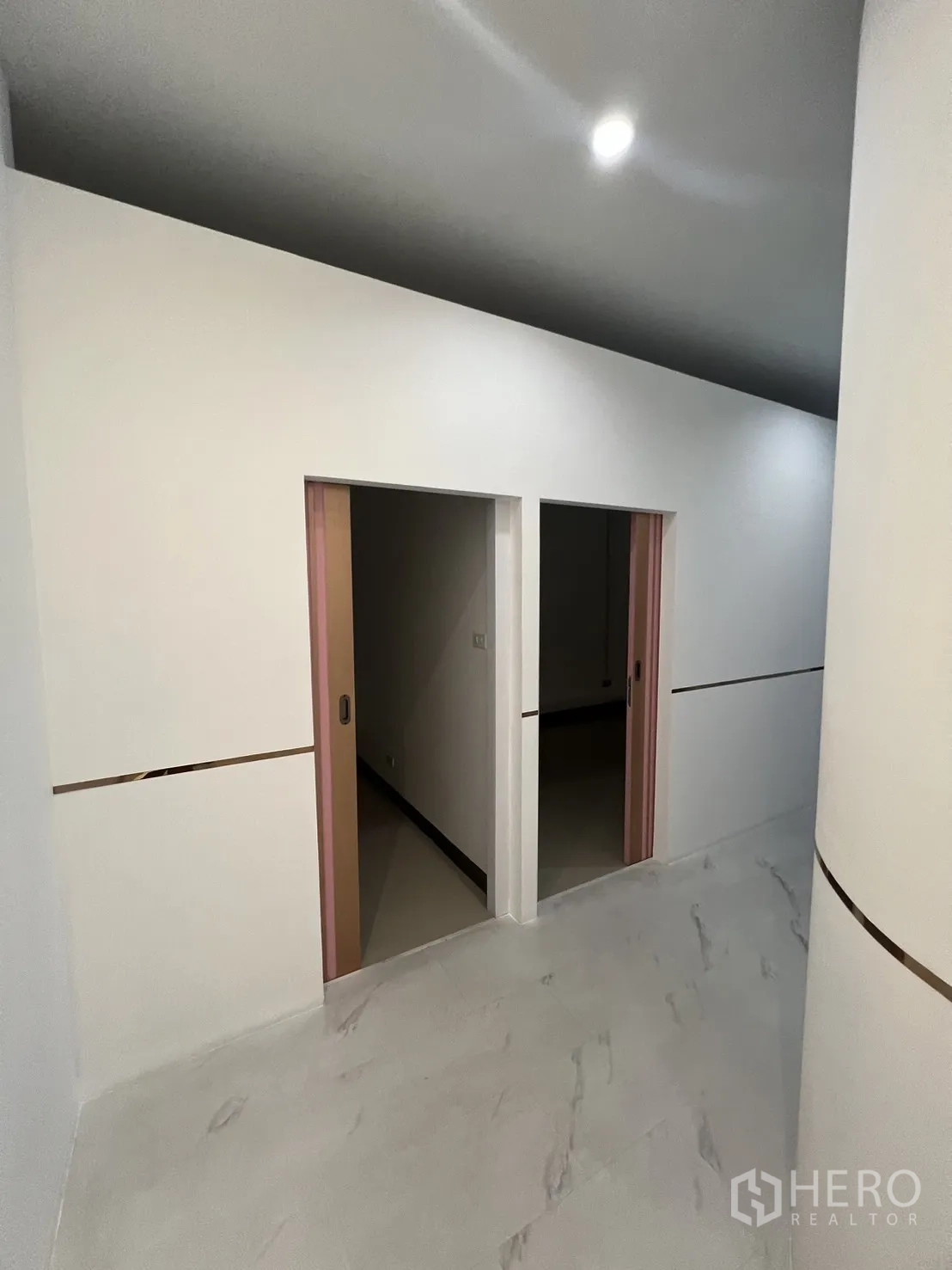 Retail Space for rent in Watthana, Bangkok - Two interior rooms with pink sliding doors off the main corridor.