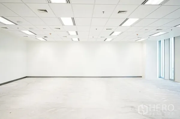 Office Space for rent in Bang Na, Bangkok - Spacious white office interior with grid ceiling, LED lighting and side windows, ready for fit-out.