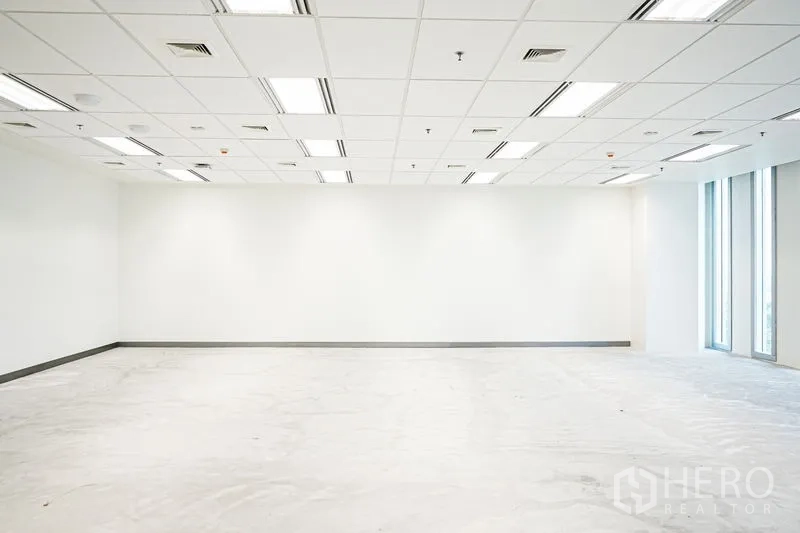 Office Space for rent in Bang Na, Bangkok - Spacious white office interior with grid ceiling, LED lighting and side windows, ready for fit-out.