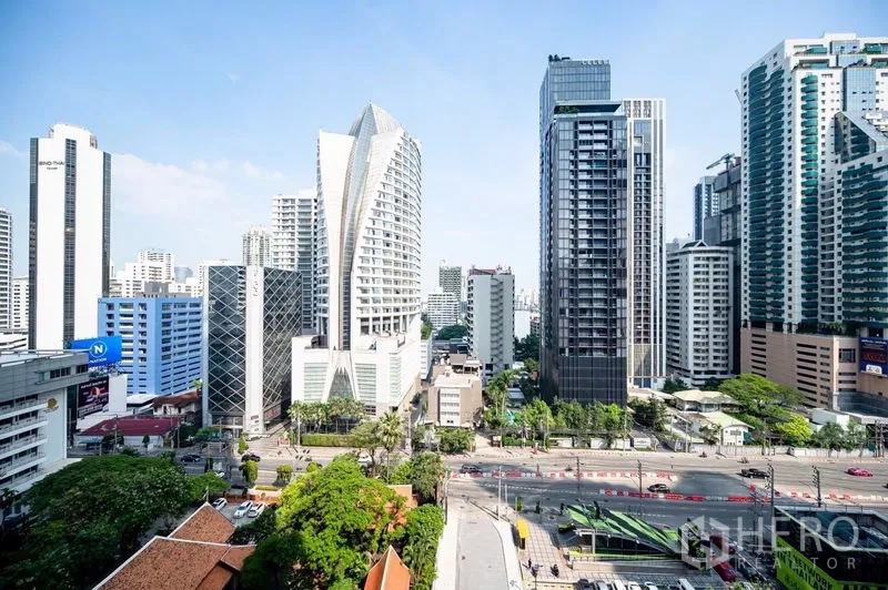Condominium for rent in Watthana, Bangkok - City skyline view of the Asok business district with modern high-rises near BTS and MRT.