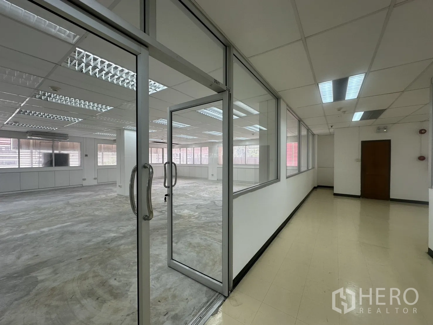 Office Space for rent in Pathum Wan, Bangkok - Glass door entry from a corridor into the office suite.