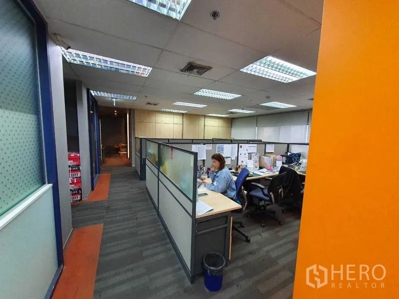 Office Space for rent in Watthana, Bangkok - Cubicle work area with desks and task chairs under bright office lighting.