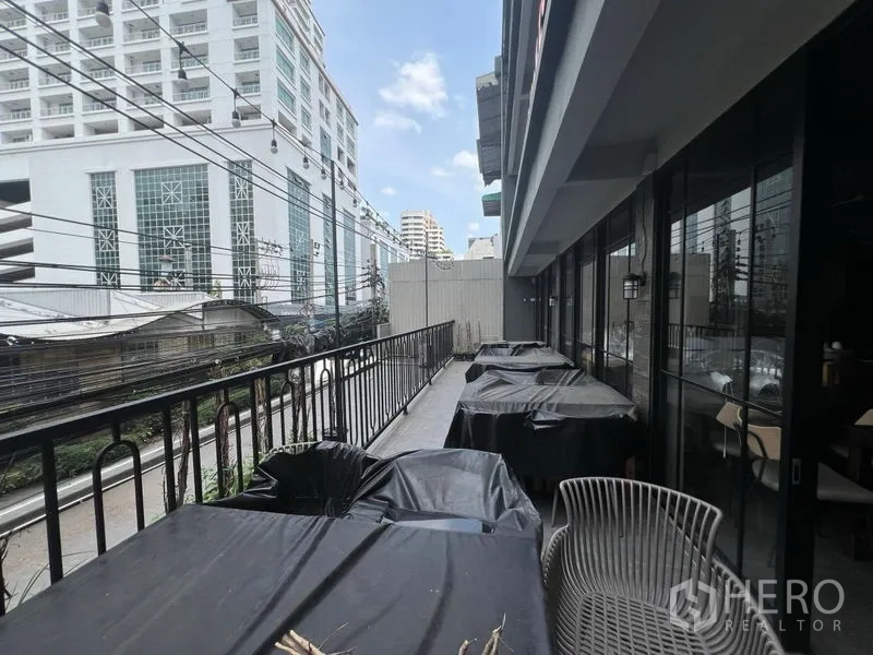 Retail Space for rent in Watthana, Bangkok - Outdoor terrace balcony beside the unit overlooking nearby city buildings.