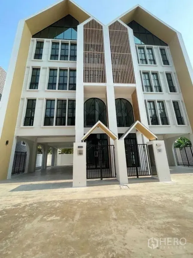 Home Office for rent in Bang Kapi, Bangkok - Contemporary gabled home office façade with double entrances and arched windows.