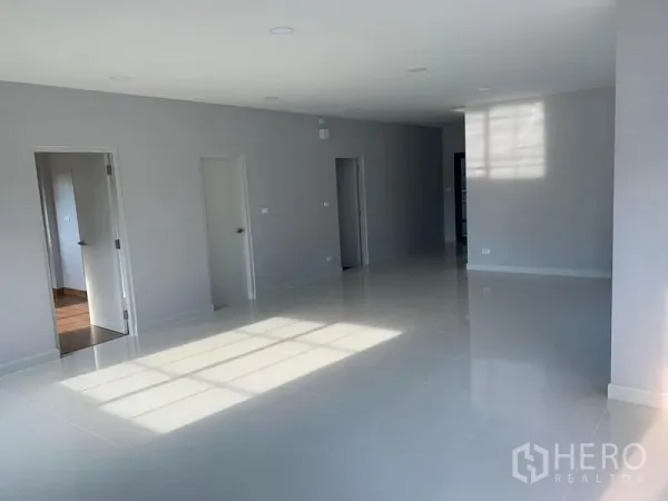 Detached House for rent or sale in Bang Phli, Samut Prakan - Spacious living and dining room with recessed lighting and multiple interior doors