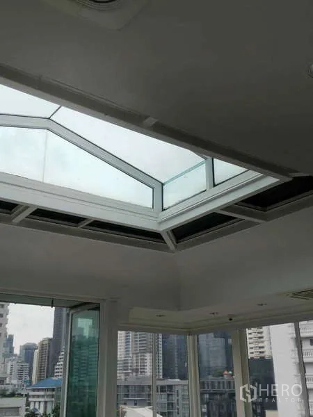 Retail Space for rent - Floor-to-ceiling windows with Bangkok skyline view.
