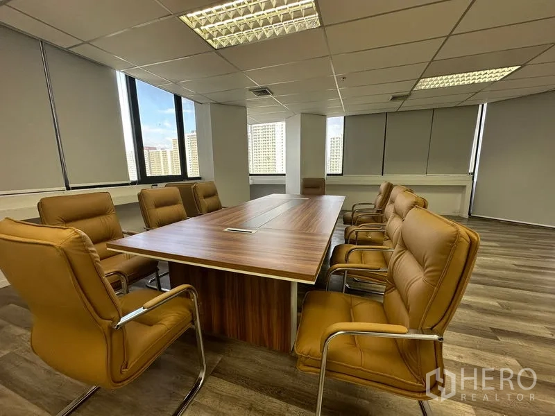 Office Space for rent or sale in Din Daeng, Bangkok - Boardroom with wood conference table, tan leather chairs and city views.