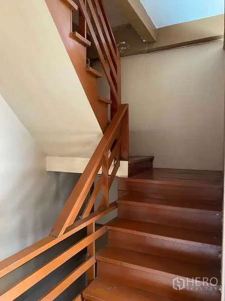 Retail Space for rent in Sathon, Bangkok - Wooden staircase connecting the retail floor to upper levels.