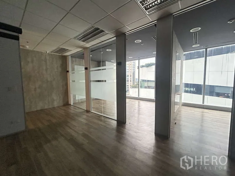 Office Space for rent - Work zone with multiple glass cubicles and natural light
