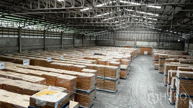 Factory for rent or sale in Pathum Thani - Open warehouse floor with organized pallet stacks and wide circulation lanes.