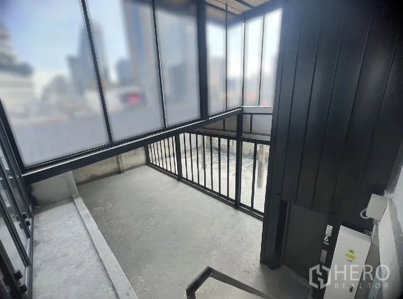 Retail Space for rent in Watthana, Bangkok - Stair lobby enclosed by translucent glass walls with black metal handrails and city views.