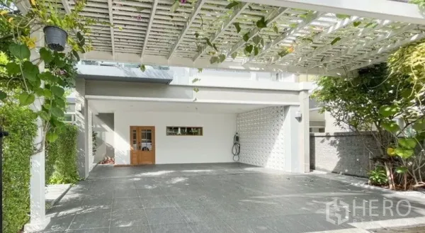 Detached House for rent - Covered carport with white pergola and climbing plants, offering multiple parking spaces and a side gate.