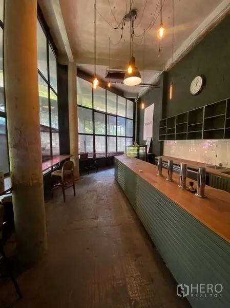 Retail Space for rent in Bang Na, Bangkok - Cafe-style counter by large windows with pendant lighting