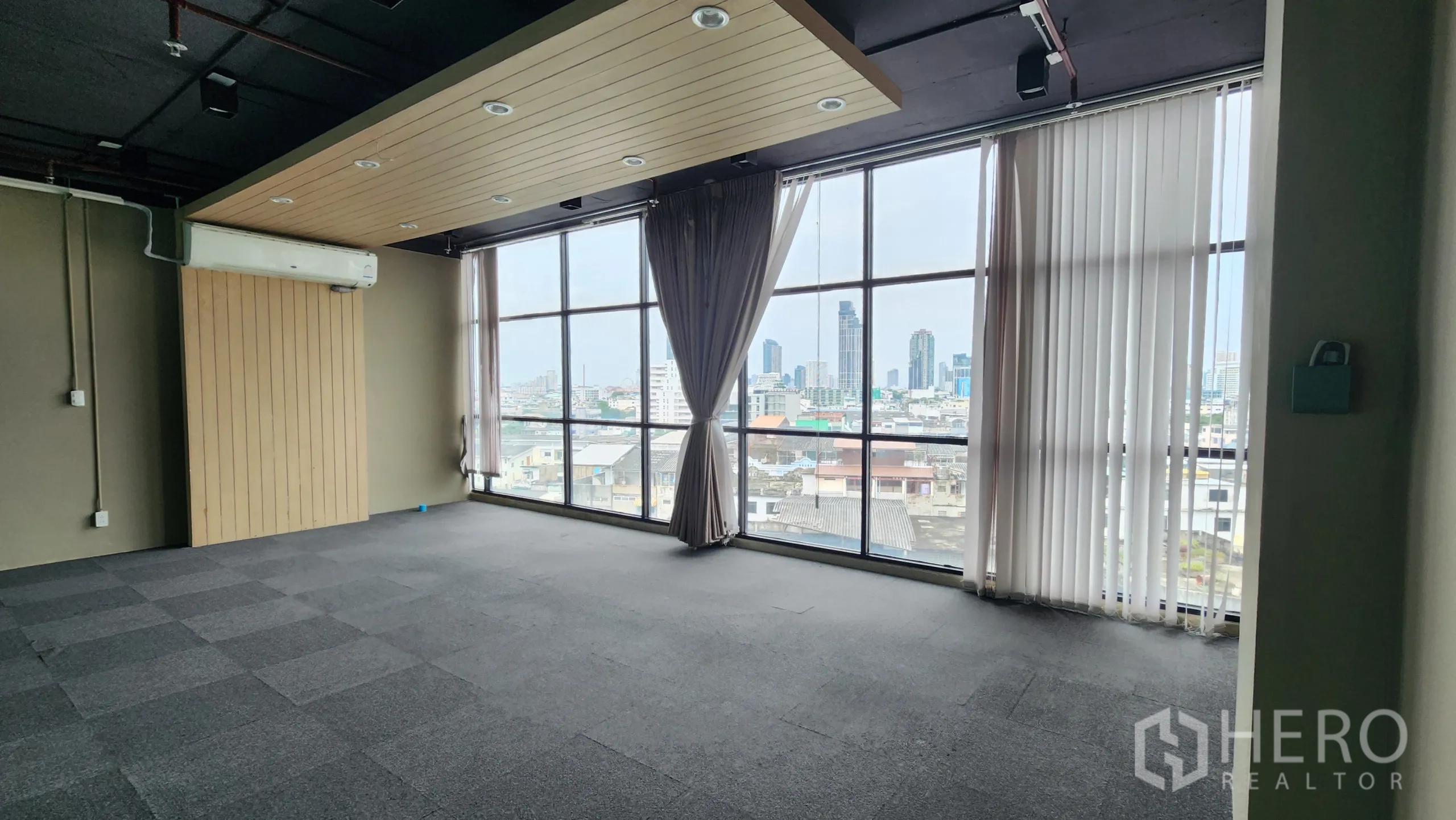 Office Space for rent in Yan Nawa, Bangkok - Framed skyline view through large window from private office.