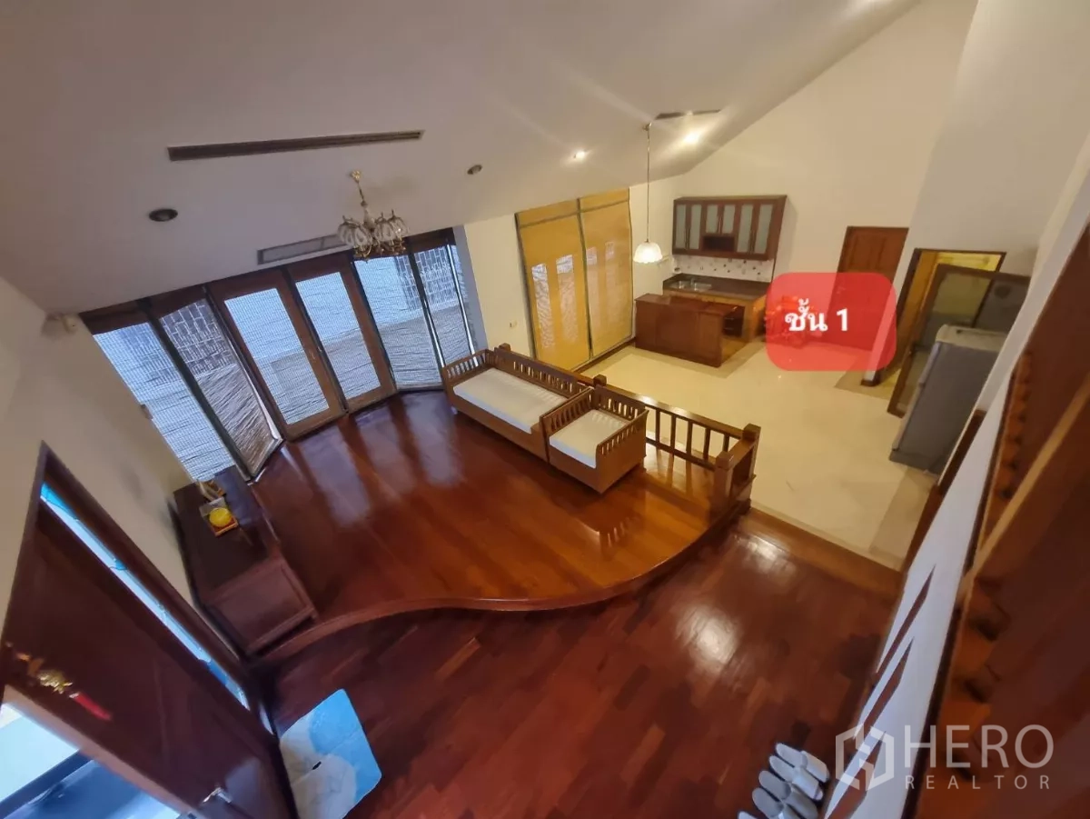 Home Office for rent or sale in Chatuchak, Bangkok - Open-plan living area with floor-to-ceiling windows and a small kitchenette.