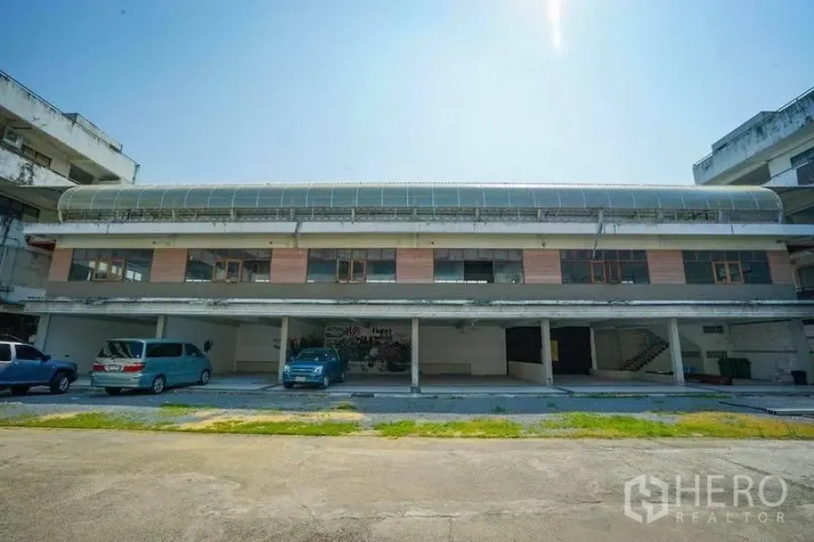 Retail Space for rent in Watthana, Bangkok - Two-storey commercial building exterior with covered parking bays and large windows in Ekkamai, Watthana.