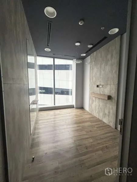 Office Space for rent - Compact meeting room with floor-to-ceiling window and built-in shelf