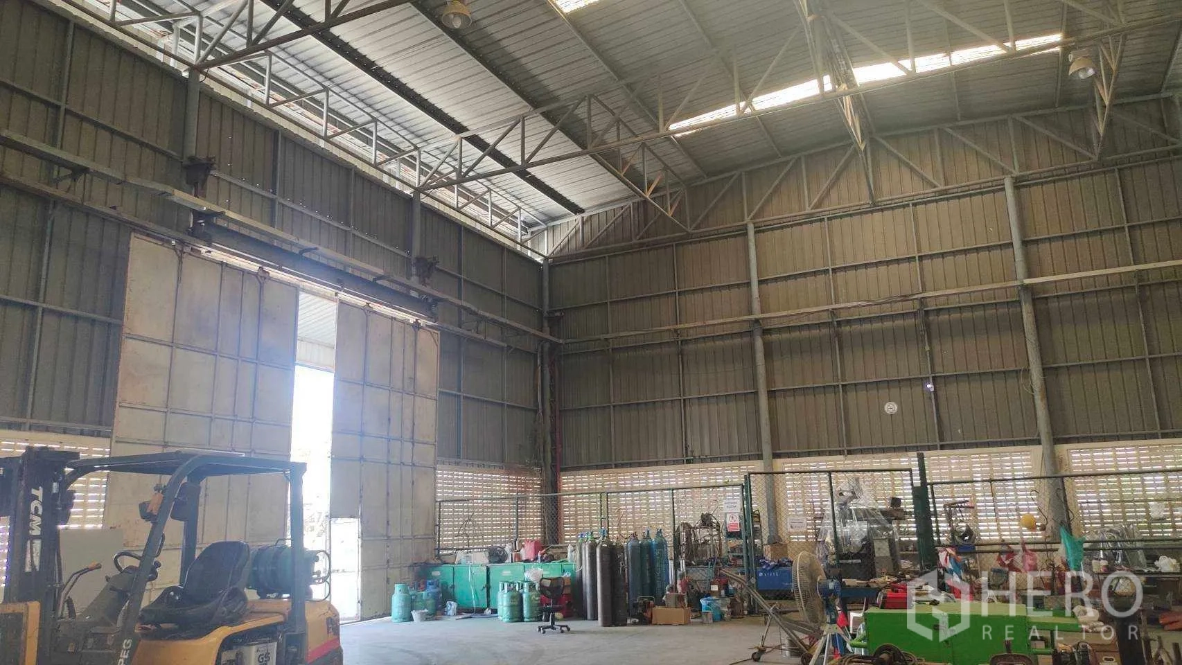 Factory for sale in Nikhom Phatthana, Rayong - Operational office workspace with desks, computers and shelving.