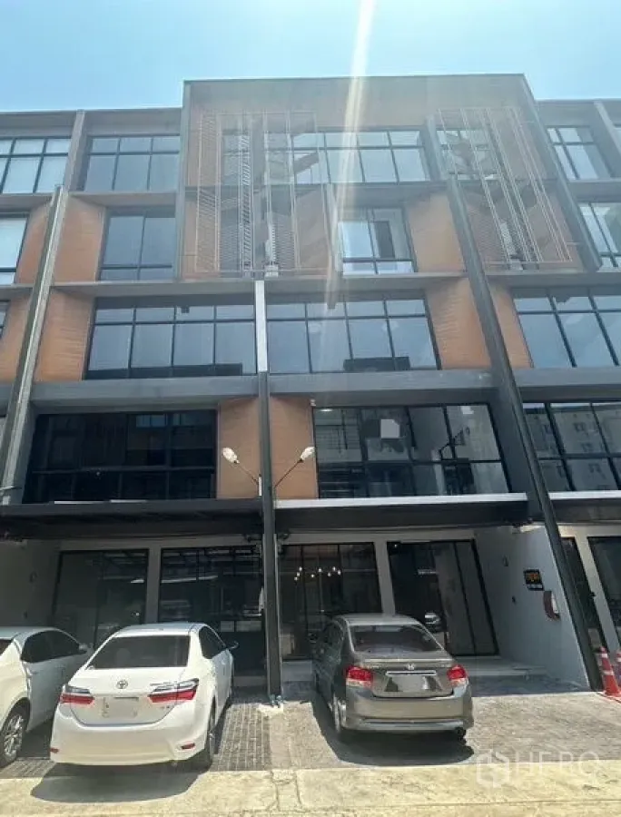 Home Office for rent - Another view of the modern facade with large windows and on-site parking.