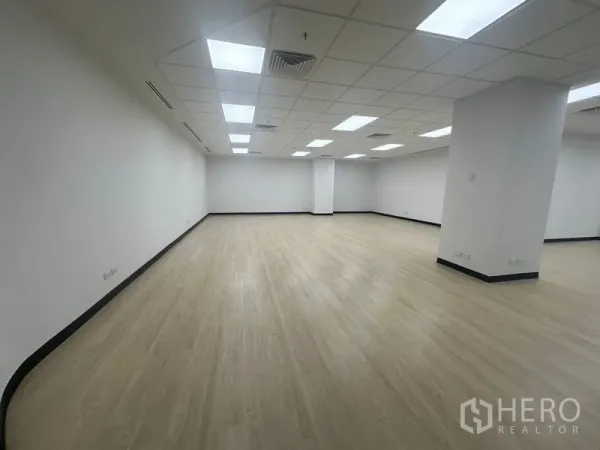 Office Space for rent in Chatuchak, Bangkok - Bright open-plan office with light wood flooring, white walls, and grid ceiling LED lights.
