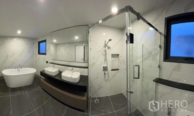 Detached House for rent - Luxury bathroom featuring a freestanding bathtub, double vanity and glass shower enclosure.