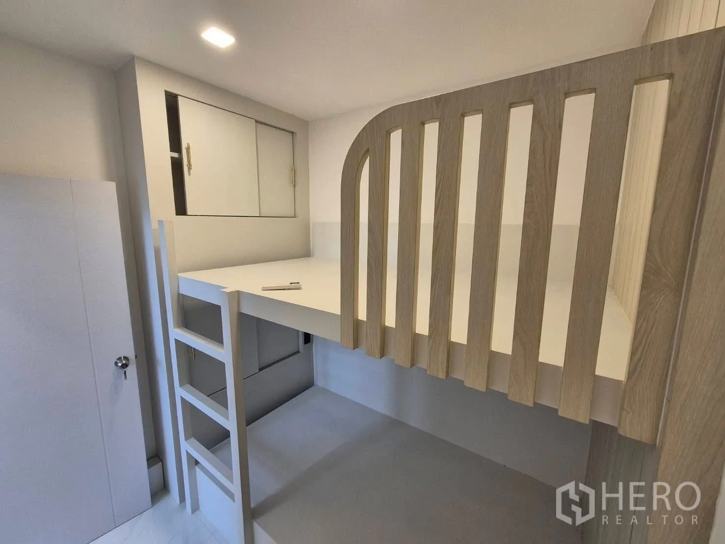 Detached House for sale in Bang Kruai, Nonthaburi - Compact bedroom with built‑in loft bed, ladder and storage cabinets.