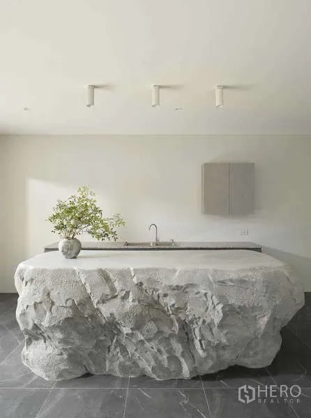 Home Office for sale in Chatuchak, Bangkok - Sculptural stone island with sink in a minimalist pantry space.
