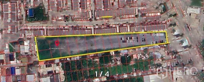 Land for rent in Prawet, Bangkok - Satellite view of a long rectangular land plot outlined in yellow along the Srinagarindra corridor, surrounded by urban housing.