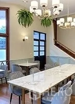 Retail Space for rent in Bangkok - Bright meeting or dining area with marble-top tables, chandeliers and hanging plants.