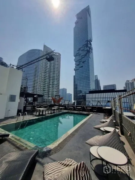 Retail Space for rent in Bang Rak, Bangkok - Lap pool with lounge chairs and the Mahanakhon tower beyond.