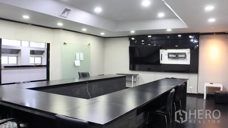 Office Space for rent in Suan Luang, Bangkok - Large conference room with U-shaped table, LED lighting and wall-mounted screen