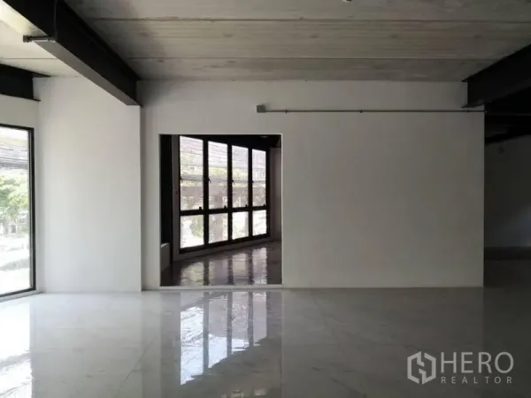 Office Space for rent in Chatuchak, Bangkok - Partition wall with doorway leading to a glass‑lined corridor and wide exterior windows.