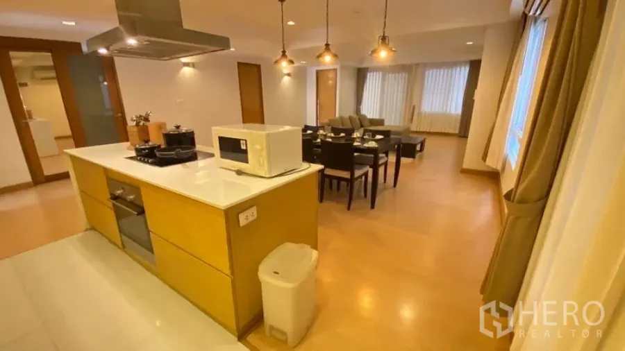 Condominium for rent - Open kitchen island with cooktop overlooking the dining and lounge areas.