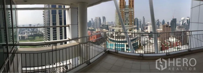 Condominium for rent or sale in Pathum Wan, Bangkok - Wide terrace balcony offering panoramic city views from a high floor.
