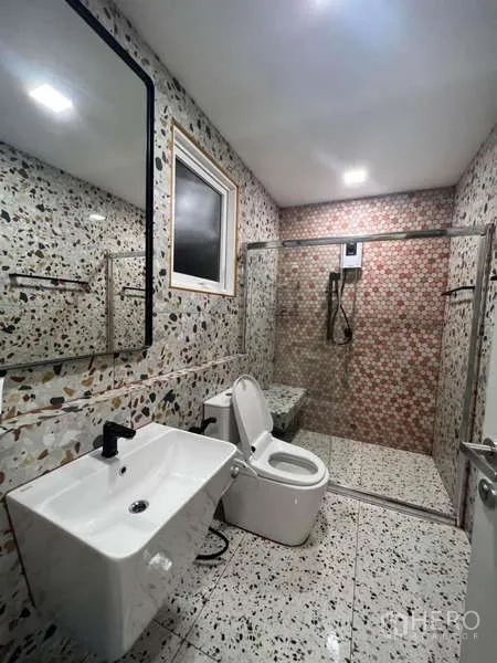Detached House for rent in Prawet, Bangkok - Second bathroom with patterned terrazzo tiles and a frameless glass shower.