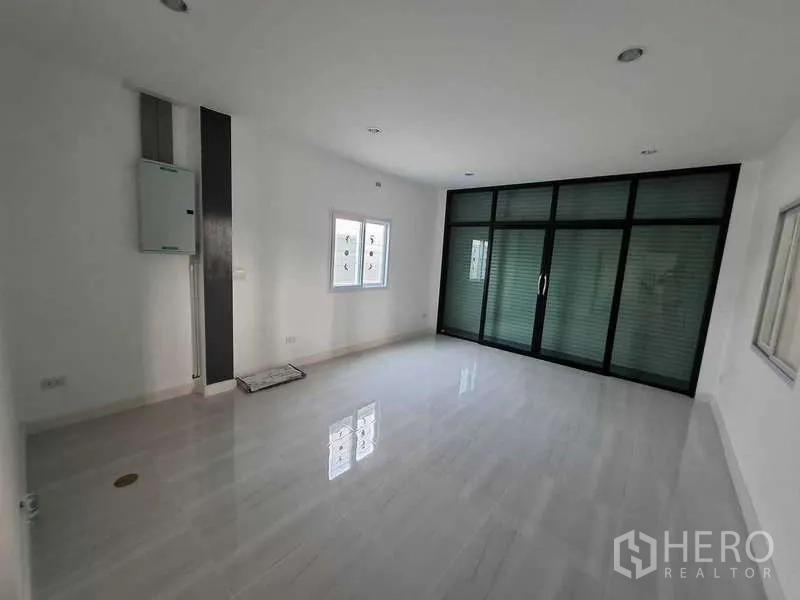 Warehouse for rent or sale in Bang Phli, Samut Prakan - Office suite with large glass doors and natural light.
